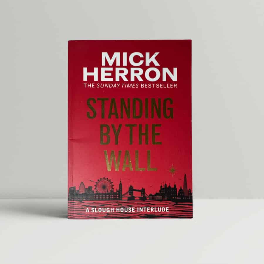 mick herron standing by the wall first edition